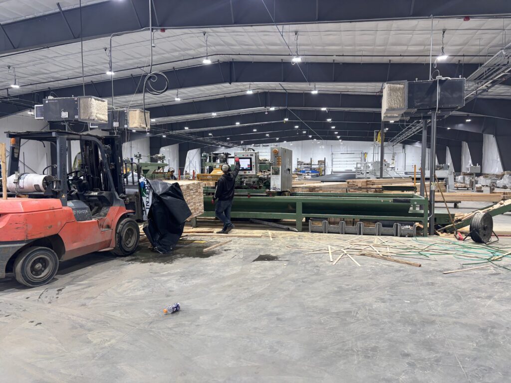 Component saw cutting truss members at Barlow Truss