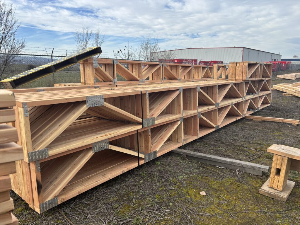 Engineered open-web floor trusses ready for delivery